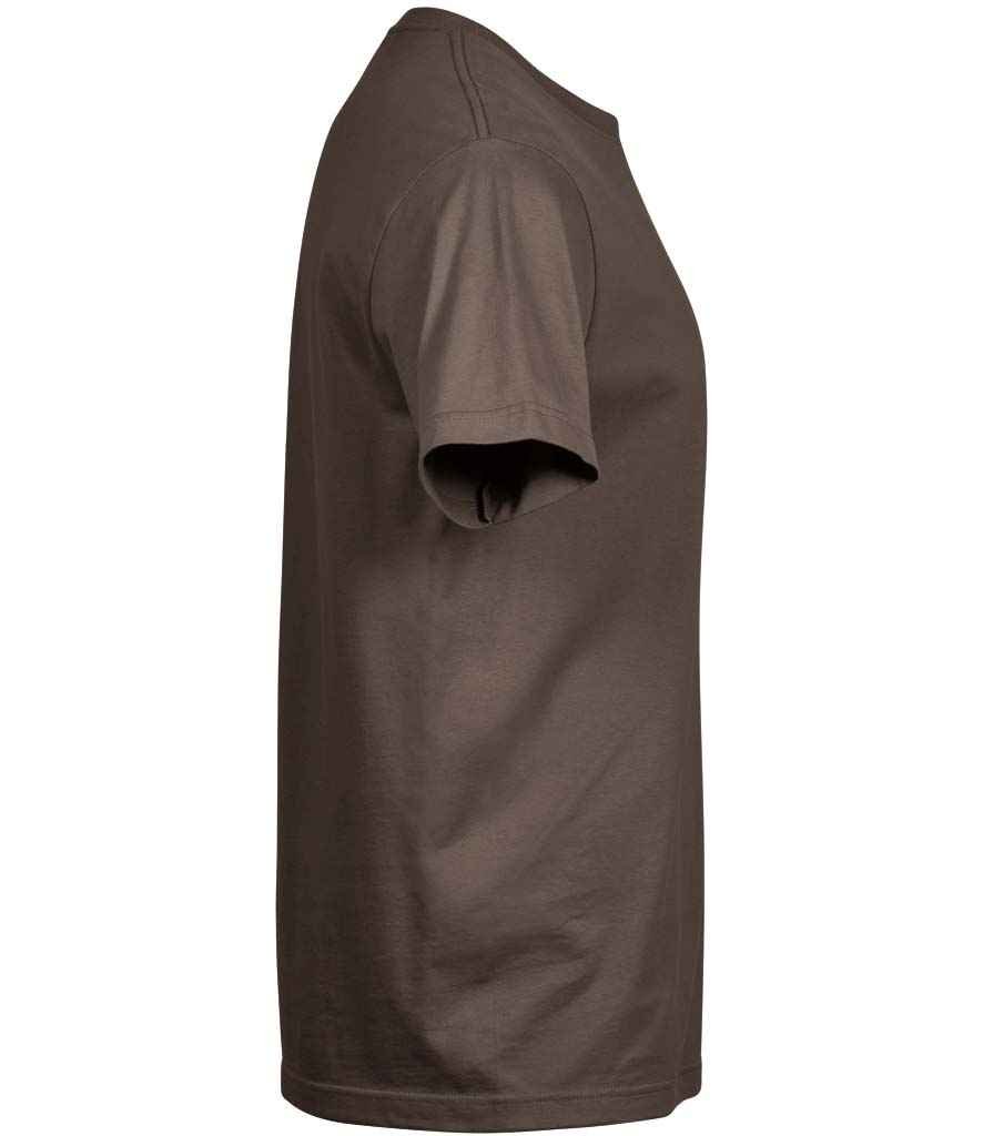 Woman applying mascara to her eyelashes with a brush.