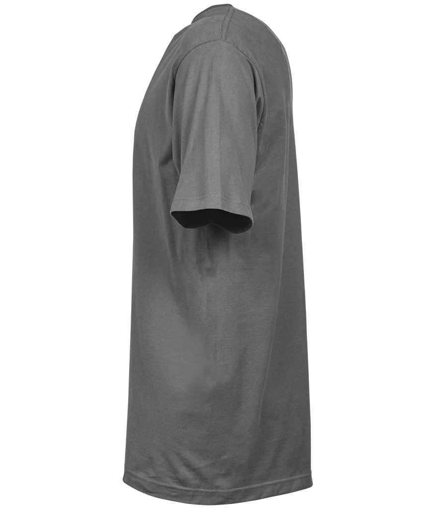 Woman applying mascara to her eyelashes with a brush.